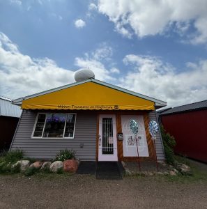 Storefront of April's Candies & Gifts on Old Highway 61 in Hinckley MN with yellow awning
